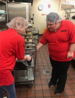 Student working in a commercial kitchen